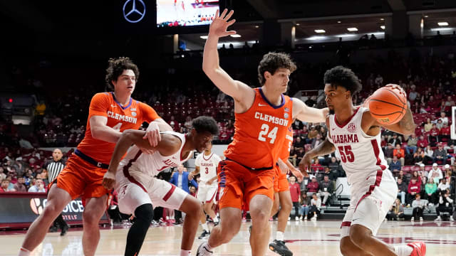 Clemson Tigers center PJ Hall (24) defends Alabama guard Aaron Estrada (55) at Coleman Coliseum.